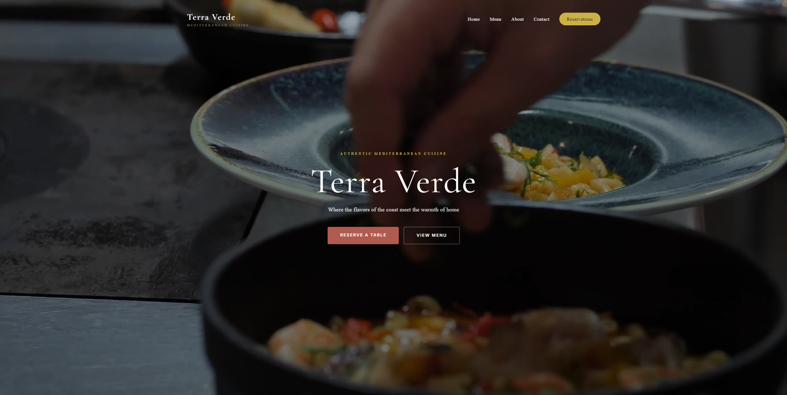 Screenshot of Terra Verde restaurant website featuring an elegant hero image of Mediterranean cuisine with reservation and menu buttons